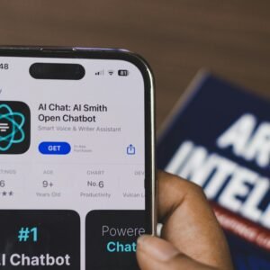 Hand holding a smartphone with AI chatbot app, emphasizing artificial intelligence and technology.
