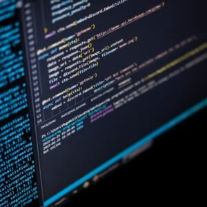 Close-up of a computer screen displaying HTML, CSS, and JavaScript code